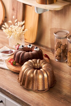 MNZ-50، سنة كيك مولد الذهب - Emsan