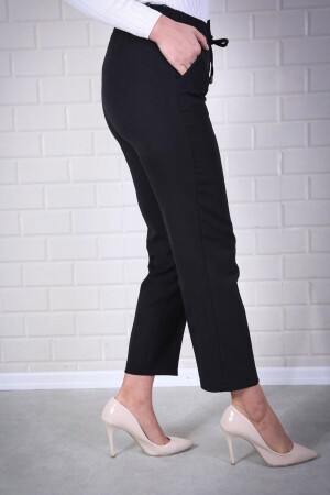 Schwarze Karottenhose mit elastischem Bund für Damen sinanurhavuc21 - 2